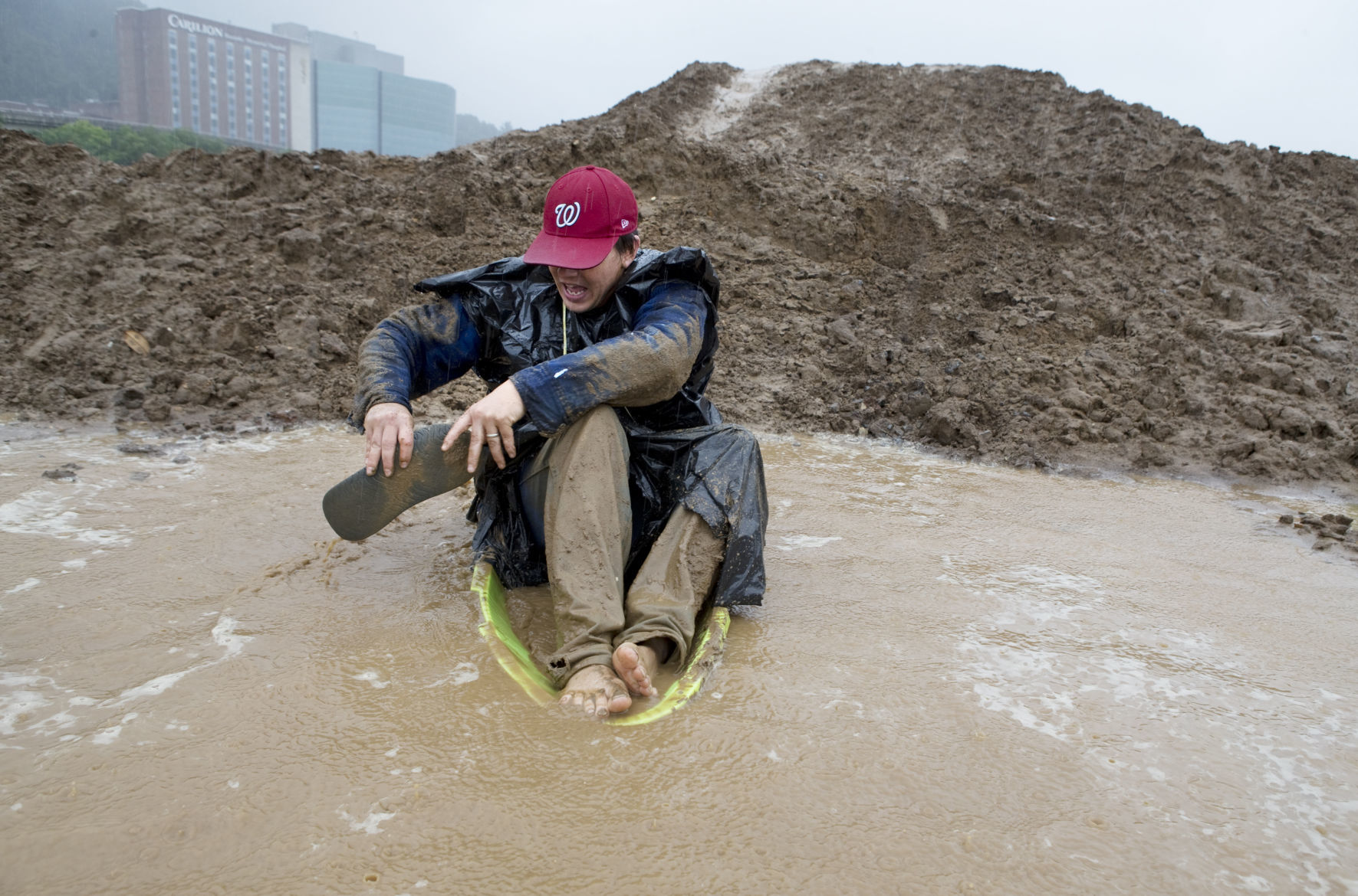 Playing in the mud at a rainy River's Edge